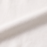 Nærbillede af det bløde bambusstof på den hvide Miffy børnet-shirt med grønt Miffy-print